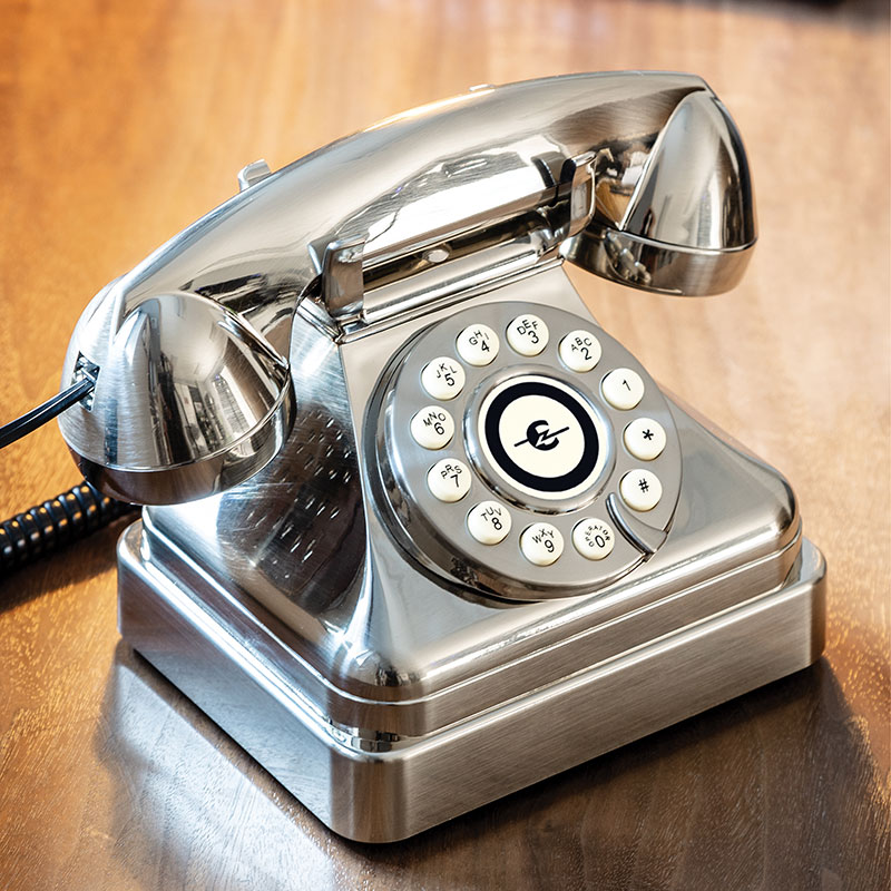 An image of Ooma Telo with Chrome Kettle Phone next to it.